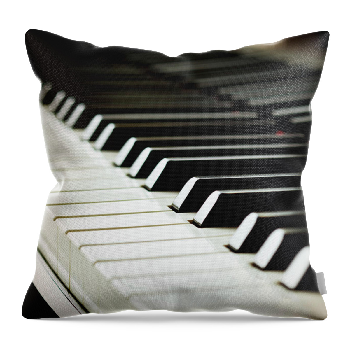 Piano Throw Pillow featuring the photograph Piano Keys by Mbbirdy