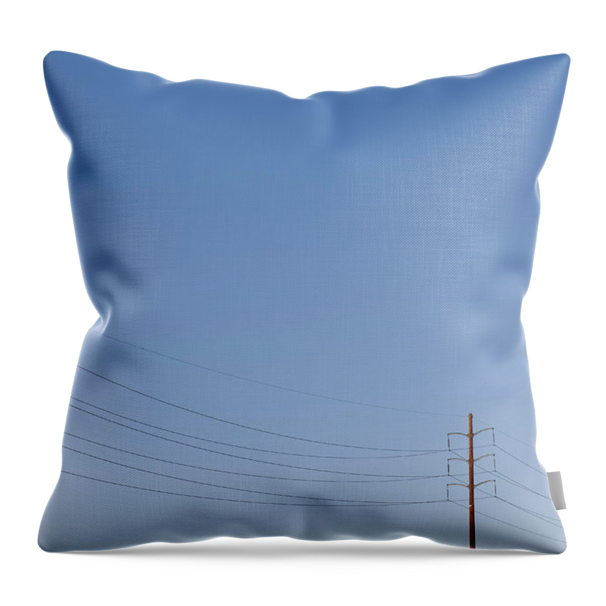 In A Row Throw Pillow featuring the photograph Power Lines Against A Clear Sky by Patrick Strattner