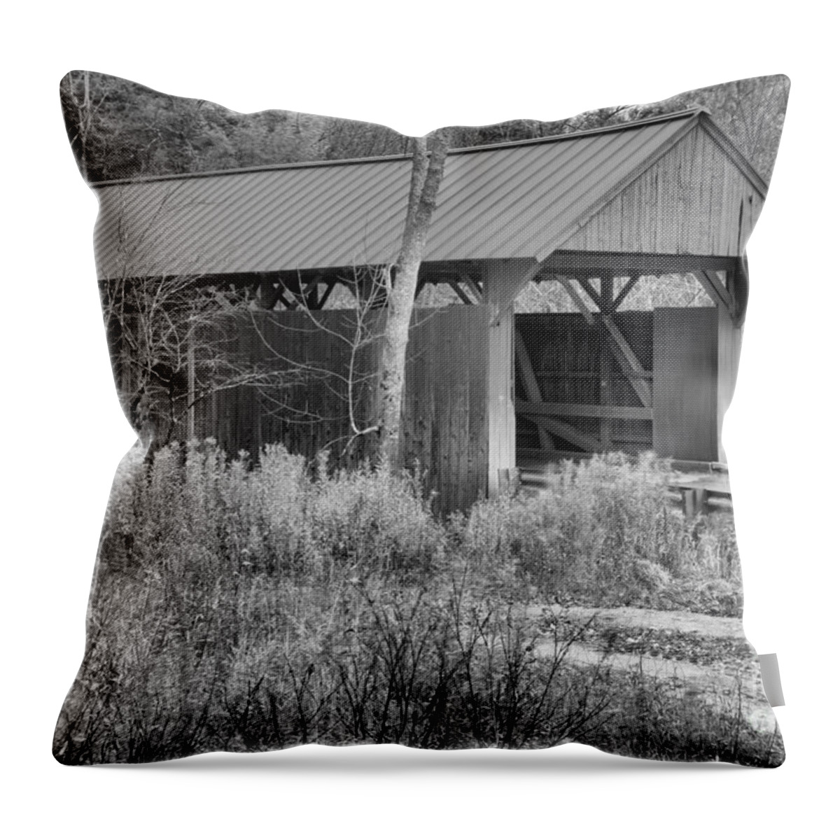 Red Covered Bridge Throw Pillow featuring the photograph Red Covered Bridge In The Brush Black And White by Adam Jewell