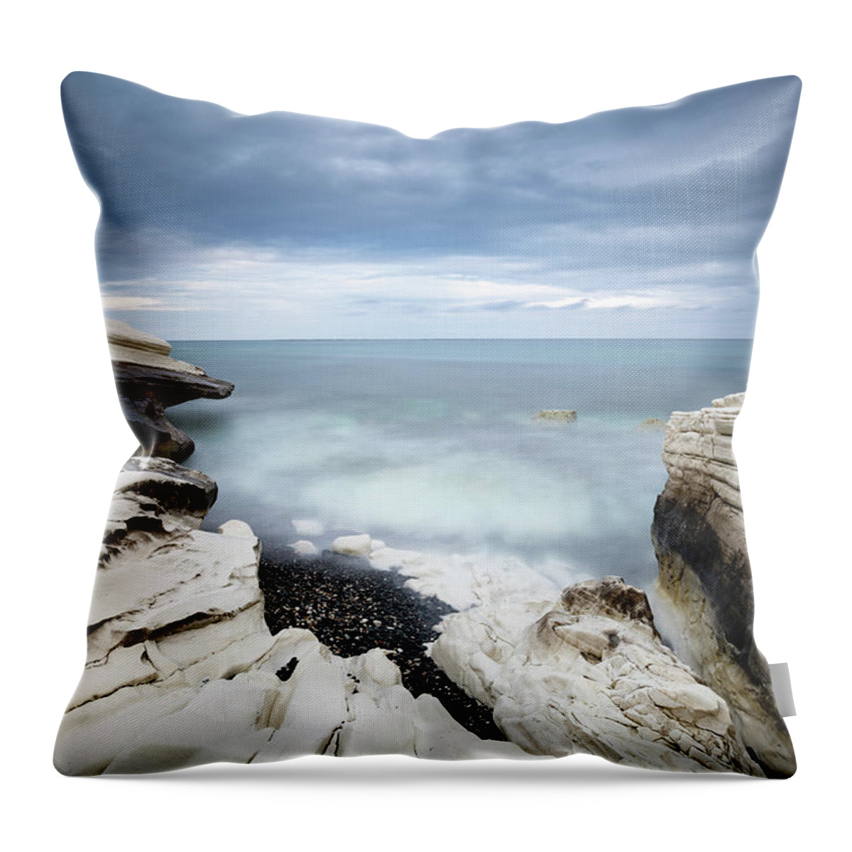 Seascape Throw Pillow featuring the photograph Rocky coast with white limestones and cloudy sky by Michalakis Ppalis