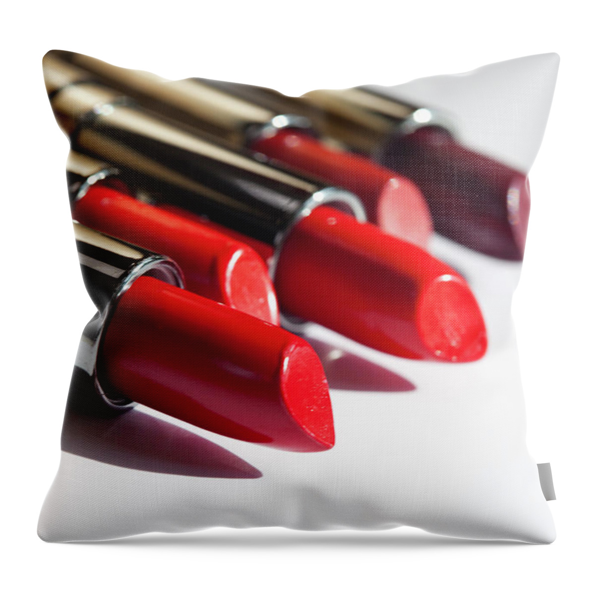 Five Objects Throw Pillow featuring the photograph Row Of Lip-sticks On White by Reggie Casagrande