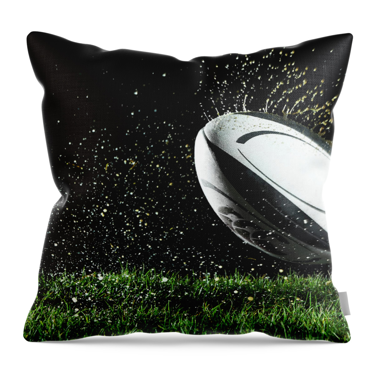 Grass Throw Pillow featuring the photograph Rugby Ball In Motion Over Grass by Thomas Northcut