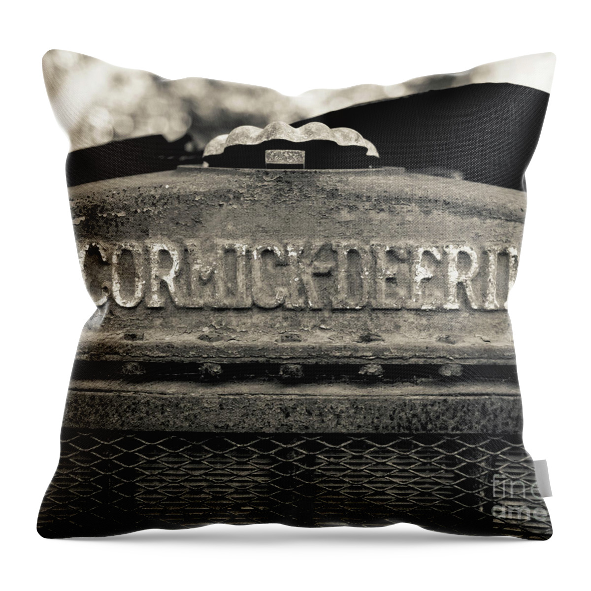 Mccormick-deering Throw Pillow featuring the photograph Rusty Old McCormick-Deering Tractor by Edward Fielding
