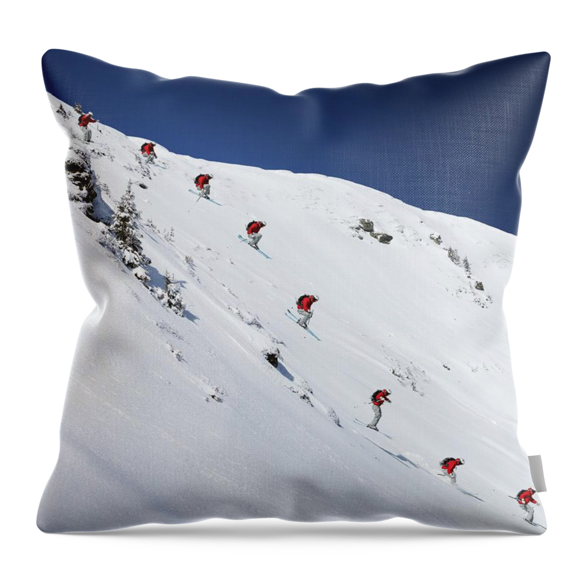 Skiing Throw Pillow featuring the photograph Sequence Of Male Skier Jumping Down by Adie Bush