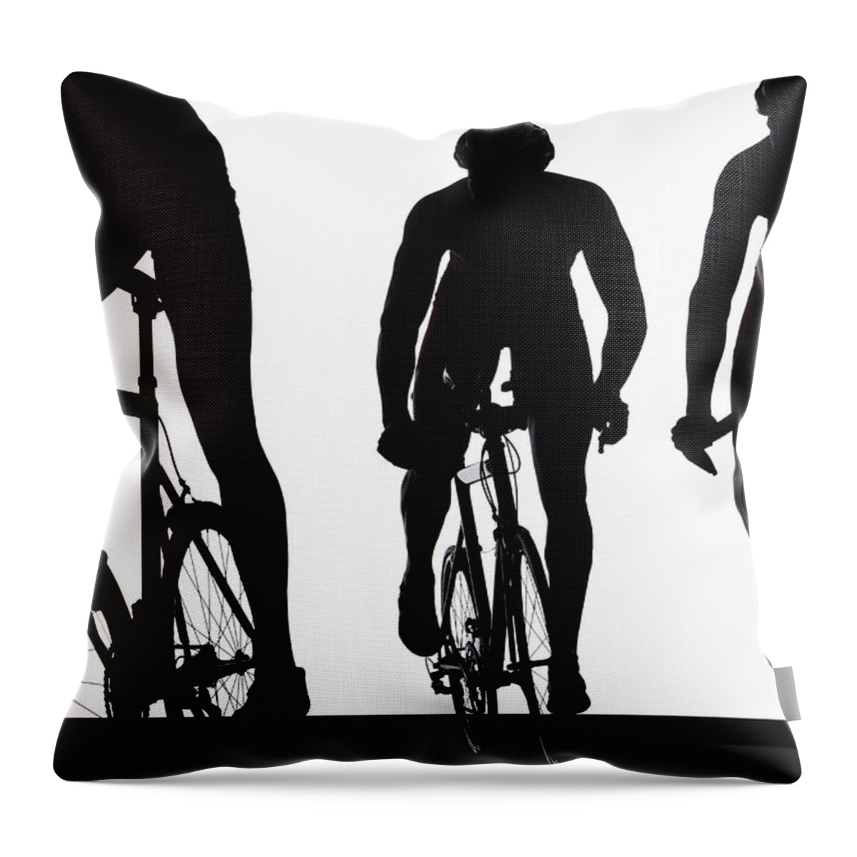 People Throw Pillow featuring the photograph Silhouette Of Three Triathletes Riding by Paul Taylor