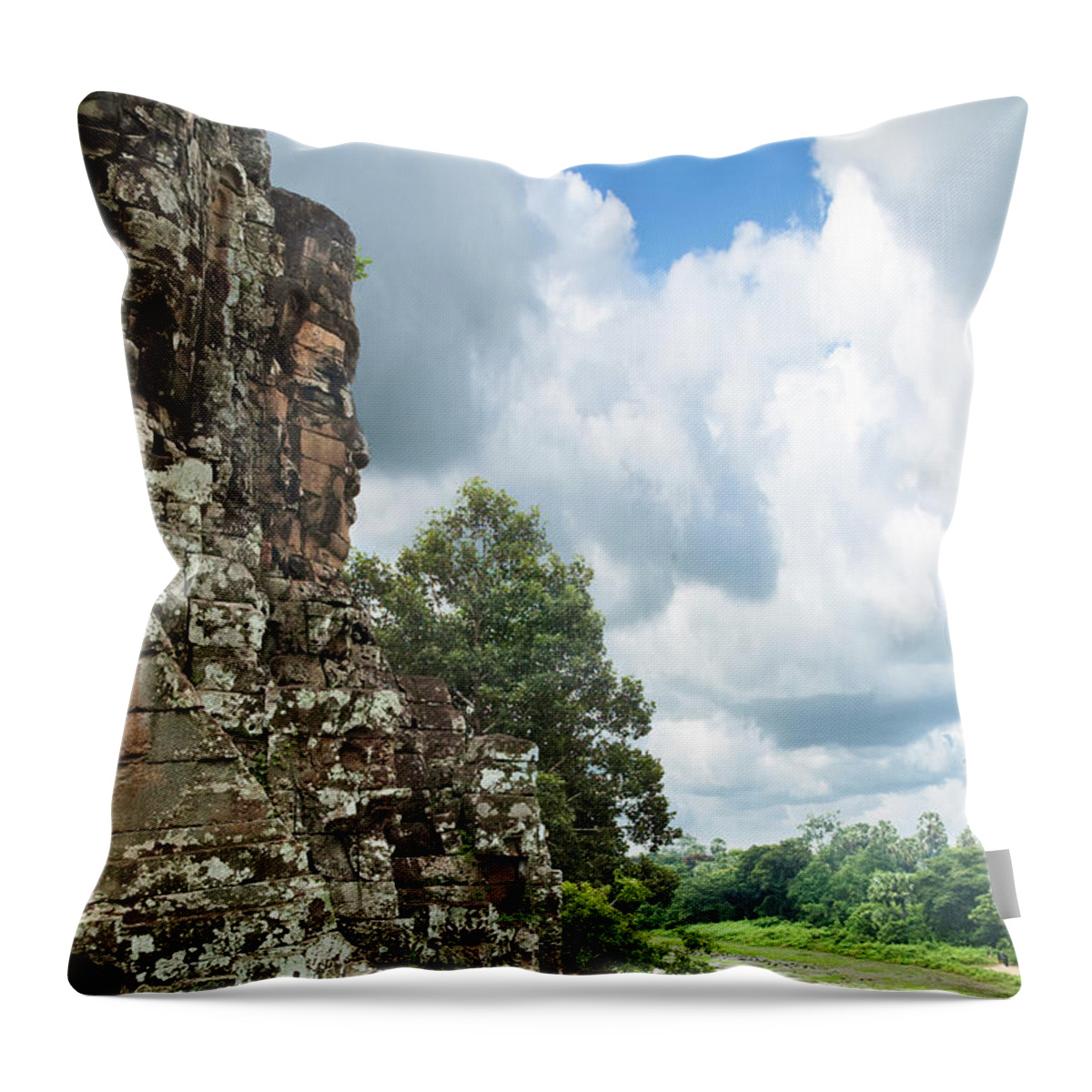 Tropical Rainforest Throw Pillow featuring the photograph The Faces Of Bayon An Angkor In Cambodia by Tbradford