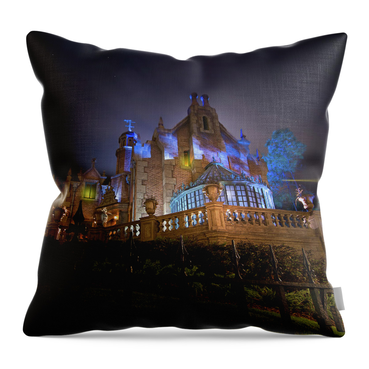 Magic Kingdom Throw Pillow featuring the photograph The Haunted Mansion at Walt Disney World by Mark Andrew Thomas