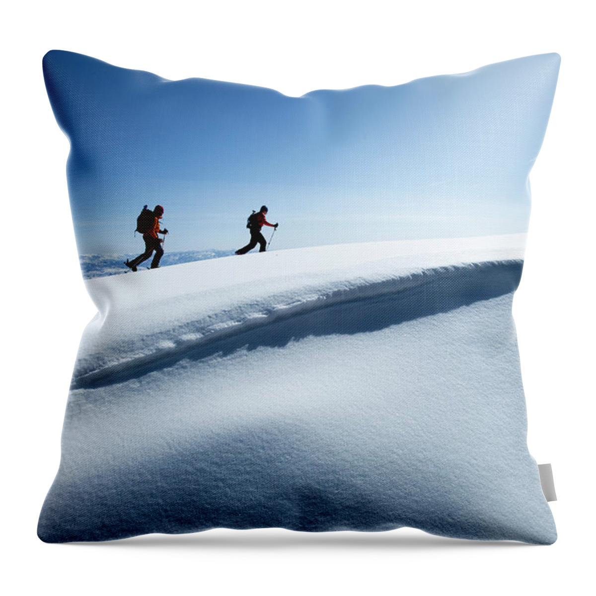 Young Men Throw Pillow featuring the photograph Two Backcountry Skiers Hiking In Fresh by Trevor Clark