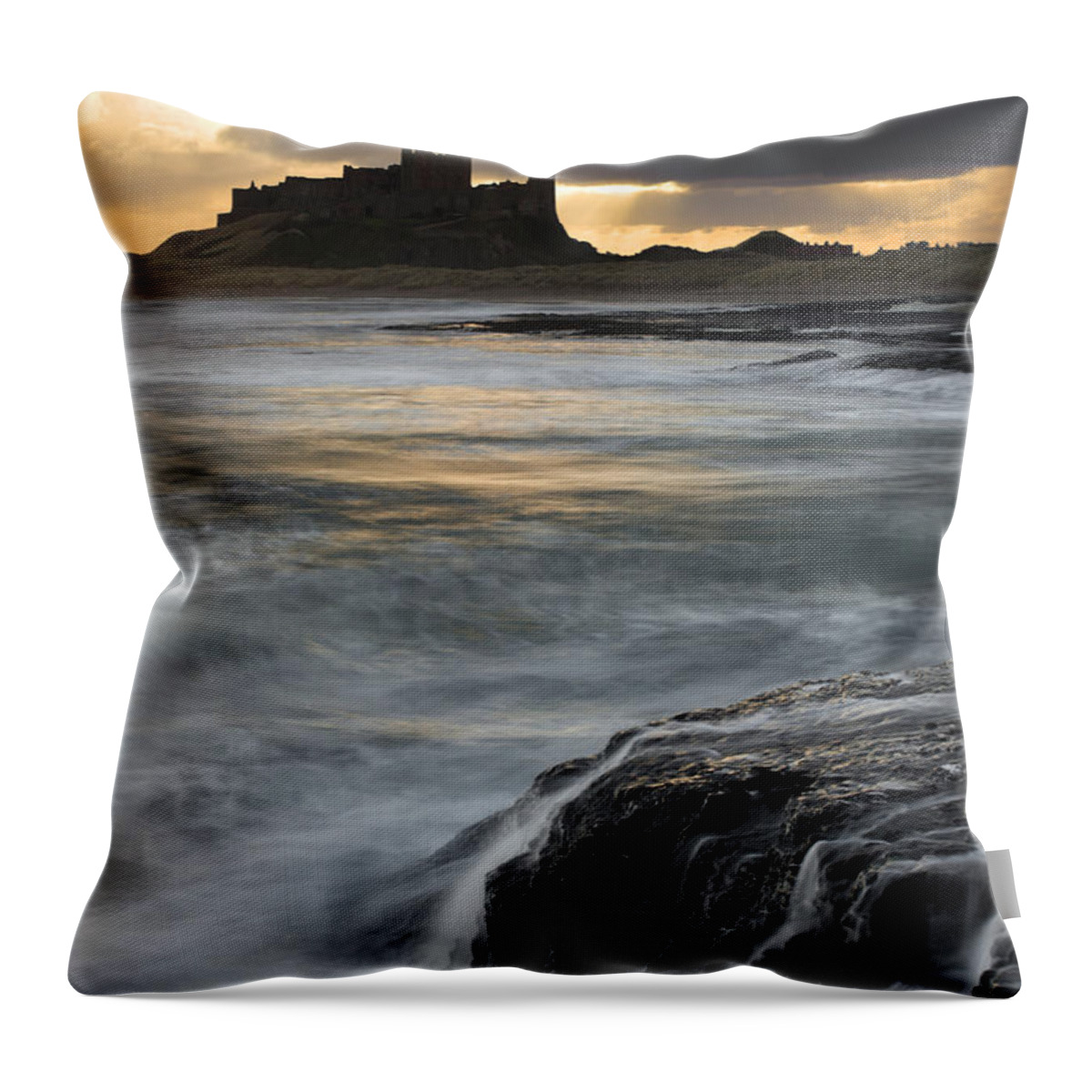 Scenics Throw Pillow featuring the photograph View Of Bamburgh Castle At Sunset by David Clapp