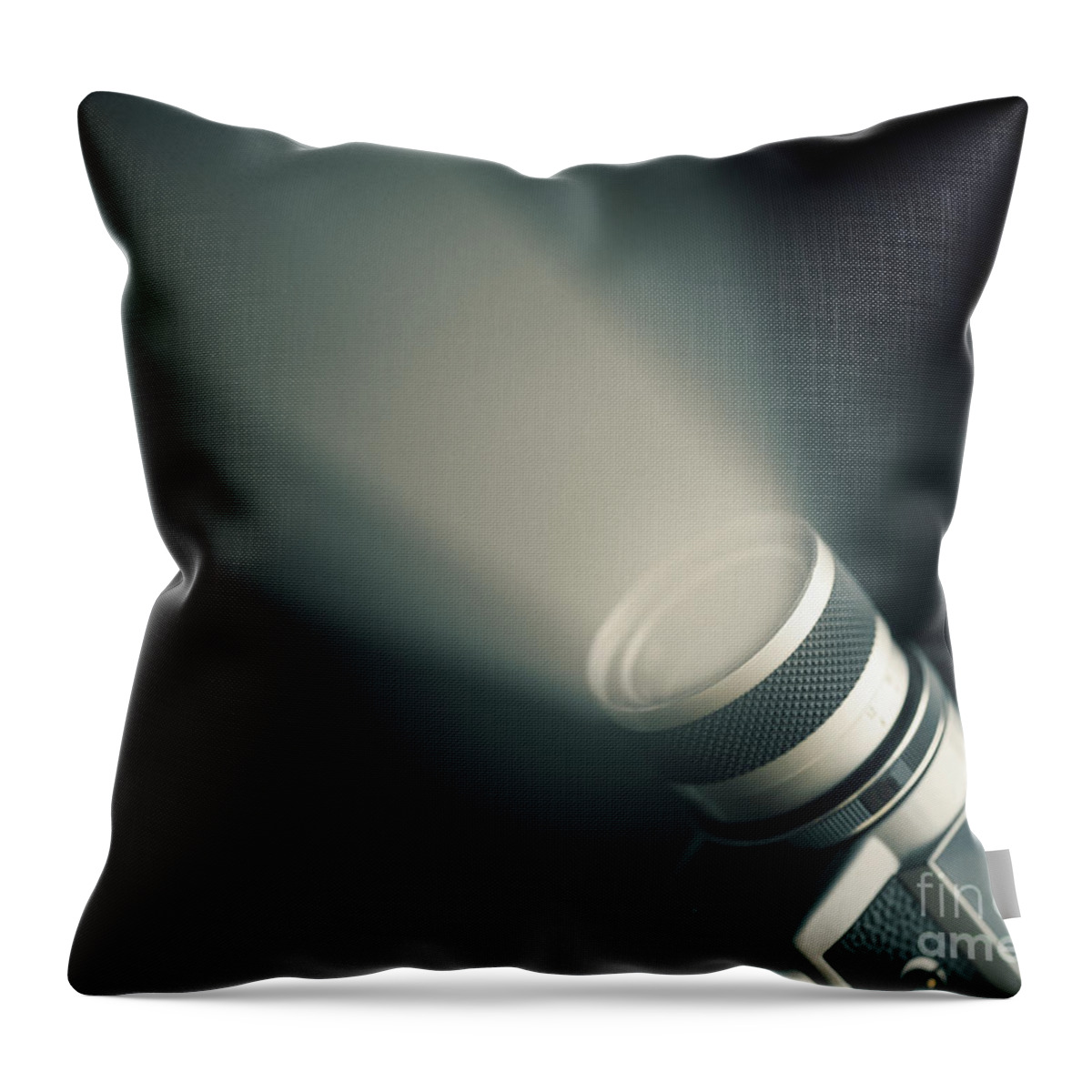 Camera Throw Pillow featuring the photograph Vintage film camera super 8mm with spotlight over black backgrou by Jelena Jovanovic