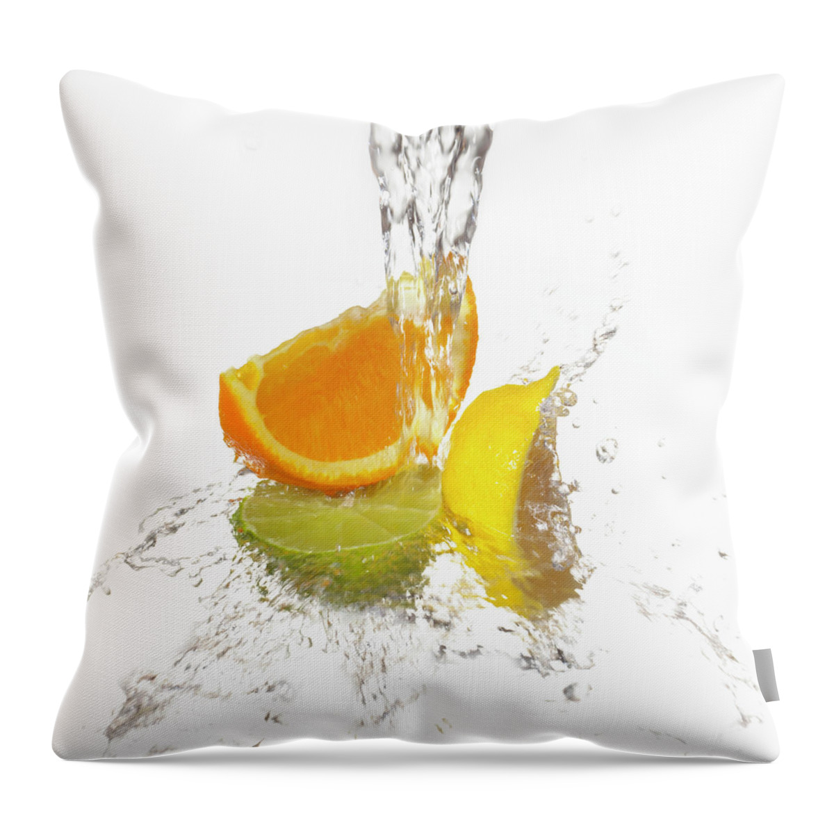 White Background Throw Pillow featuring the photograph Water Splashing On Citrus Slices by Annabelle Breakey