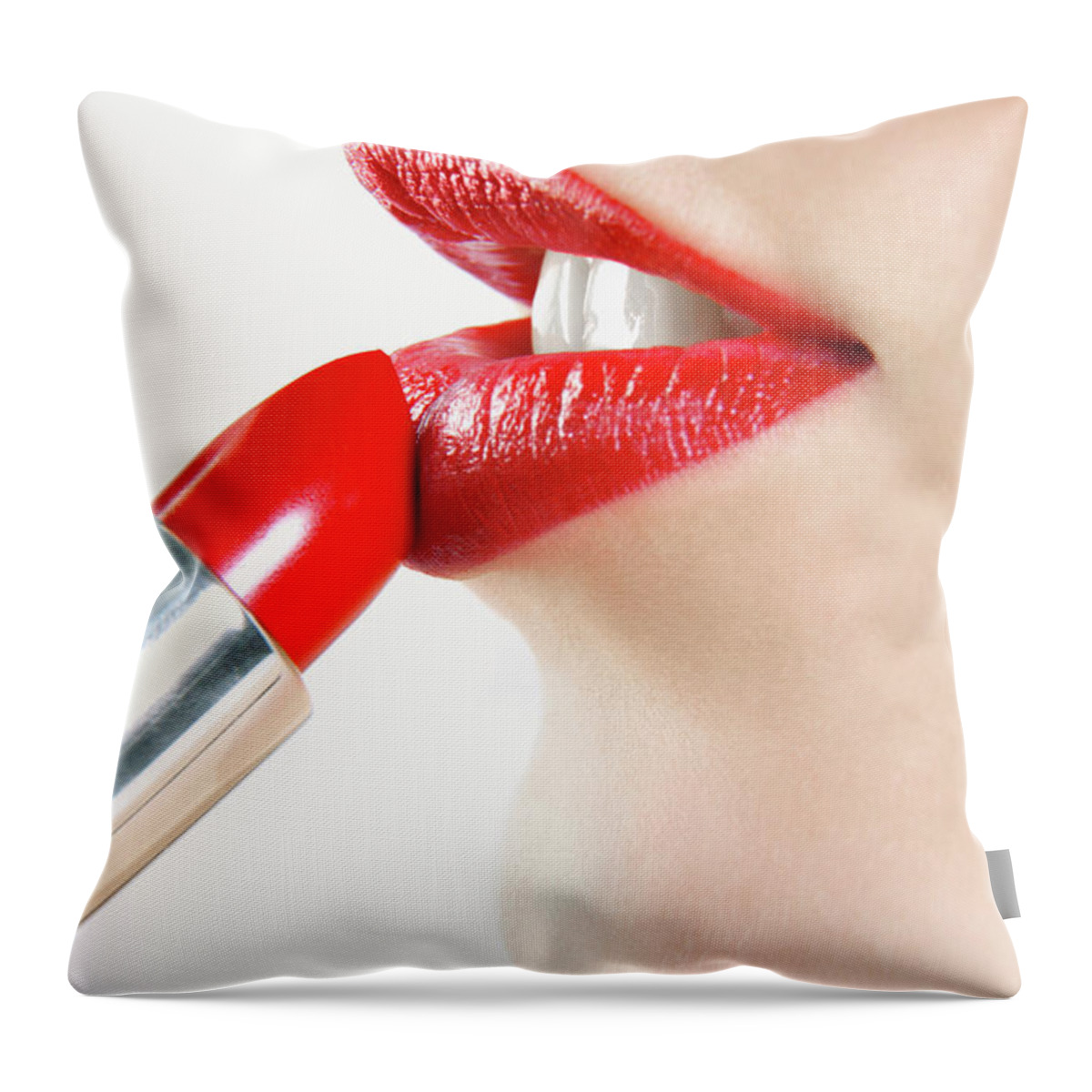 White Background Throw Pillow featuring the photograph Woman Applying Red Lipstick by Digital Vision.