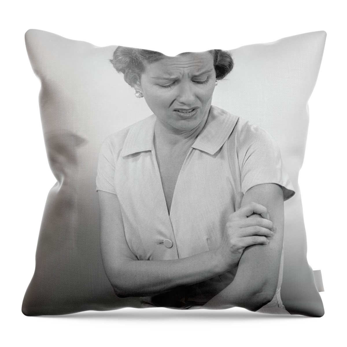 People Throw Pillow featuring the photograph Woman Massaging Arm by George Marks