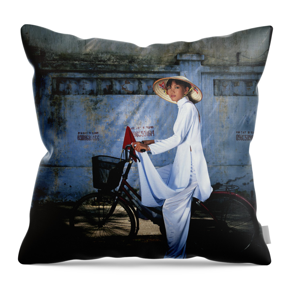 Ho Chi Minh City Throw Pillow featuring the photograph Young Woman Astride Bicycle, Portrait by Buena Vista Images