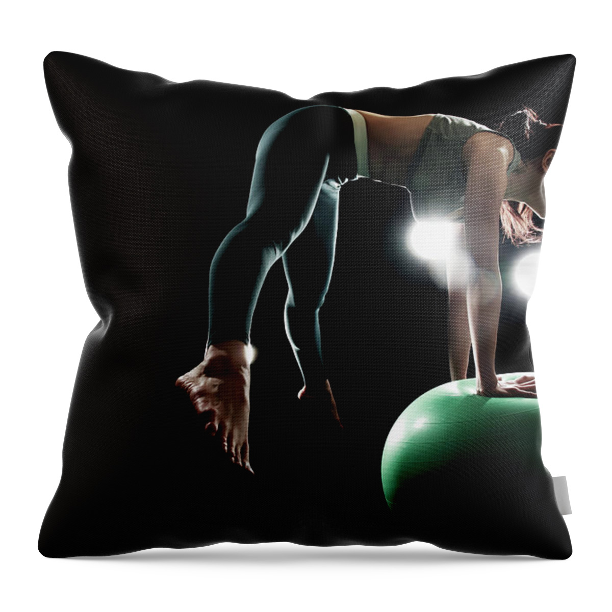 People Throw Pillow featuring the photograph Young Woman Exercising With Fitness Ball by Runphoto