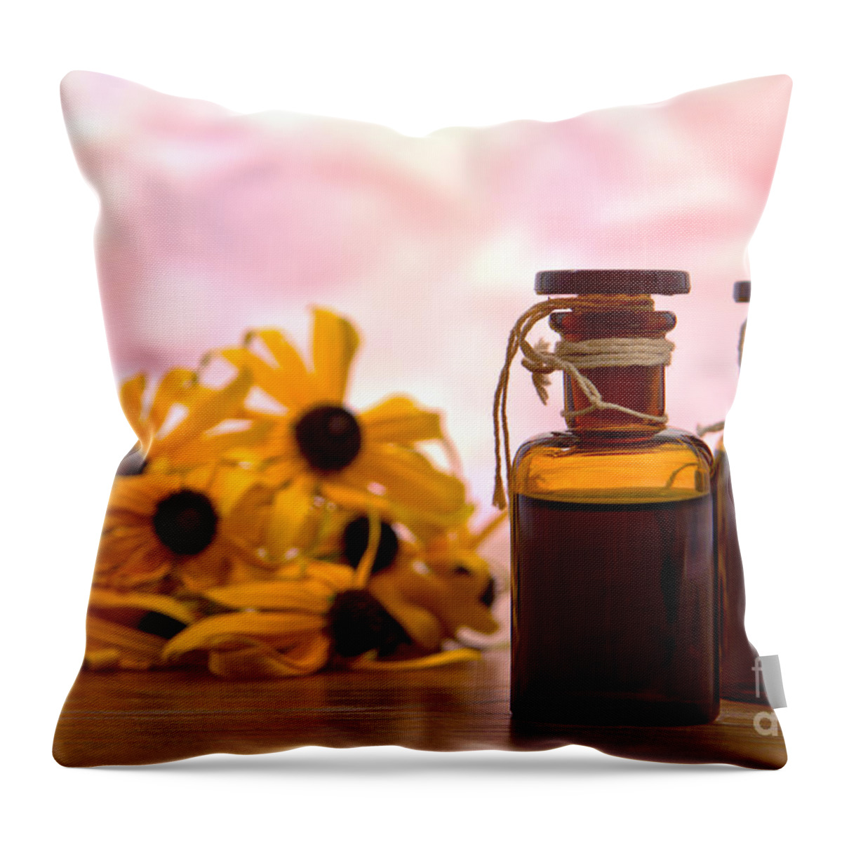 Amber Throw Pillow featuring the photograph Amber Aromatherapy Bottle with Flower Background by Olivier Le Queinec