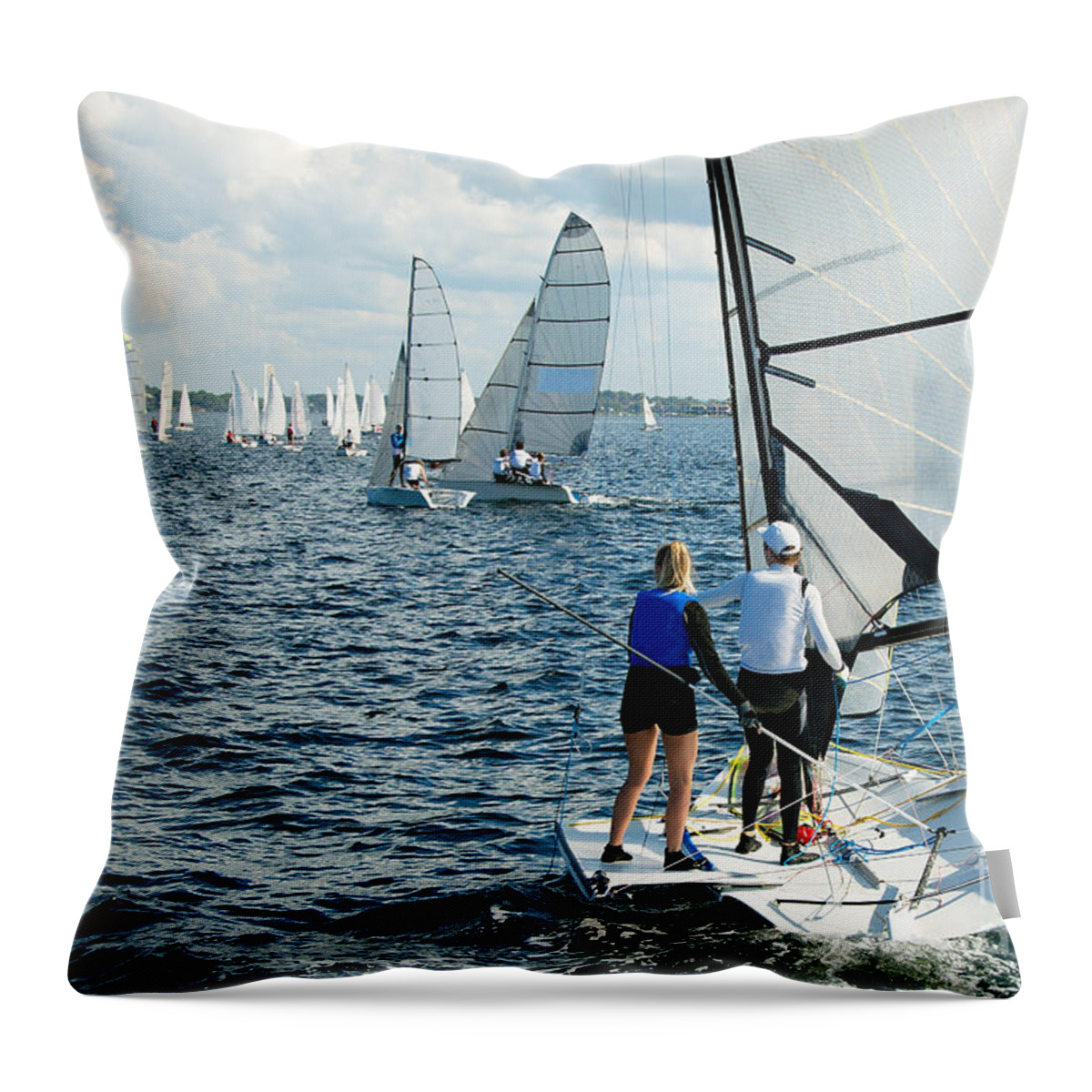 Csne21 Throw Pillow featuring the photograph Children Sailing small sailboat stern view on an inland waterway #1 by Geoff Childs