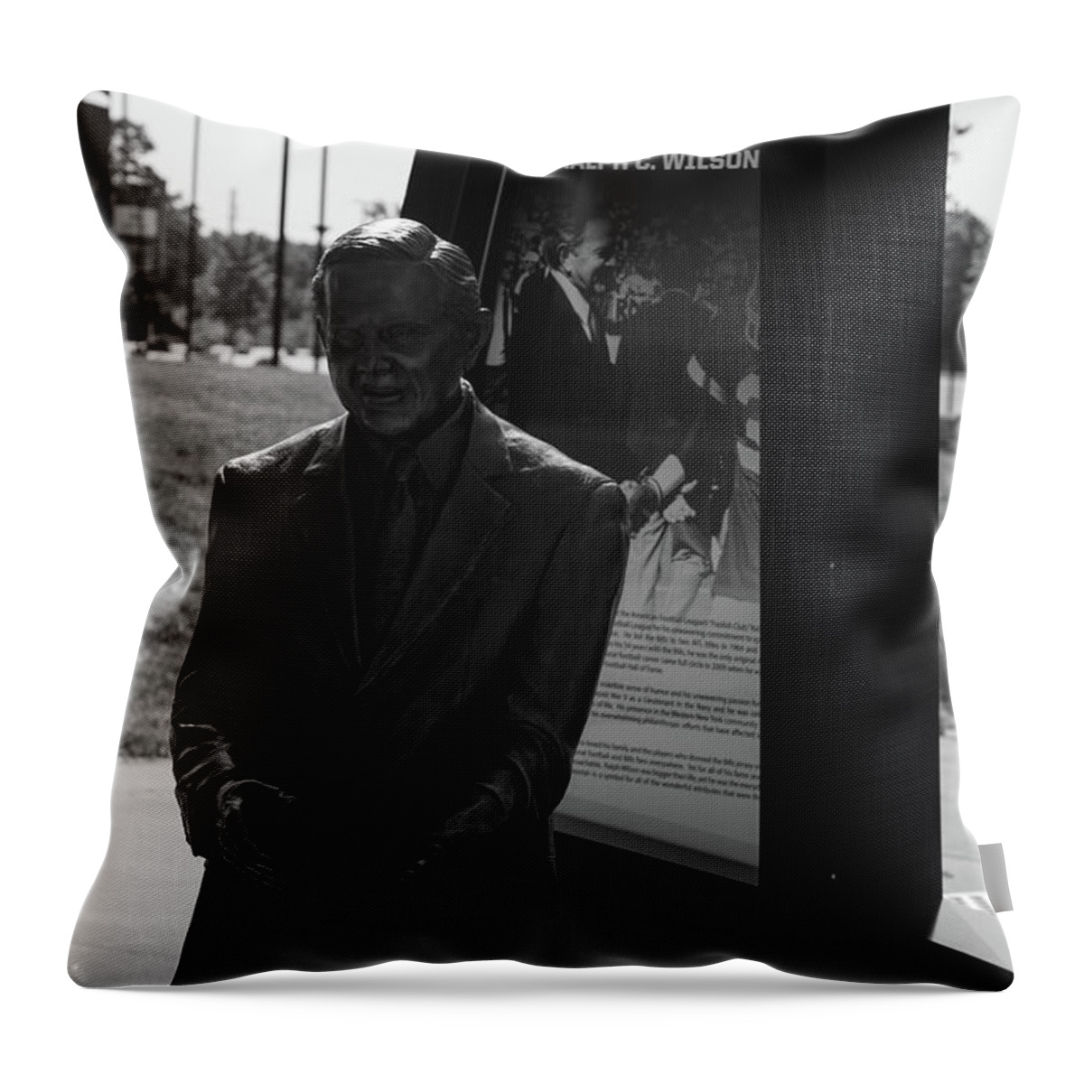 Buffalo New York Throw Pillow featuring the photograph Ralph Wilson statue at Buffalo Bills Stadium in black and white #1 by Eldon McGraw