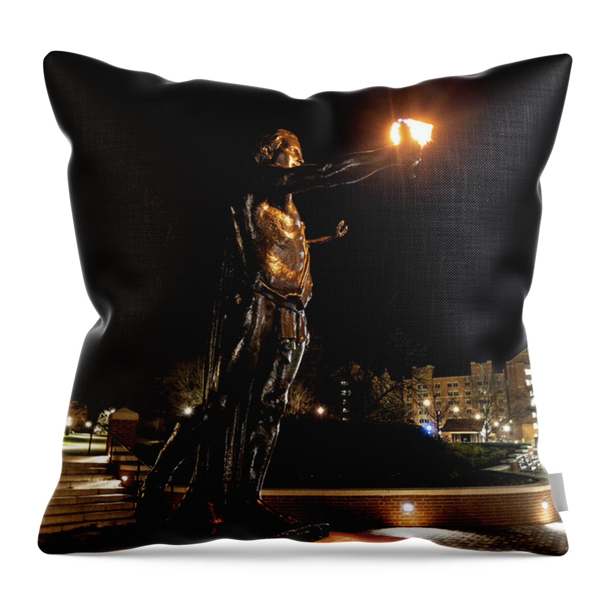 University Of Tennessee At Night Throw Pillow featuring the photograph Torchbearer statue at the University of Tennessee at night #2 by Eldon McGraw