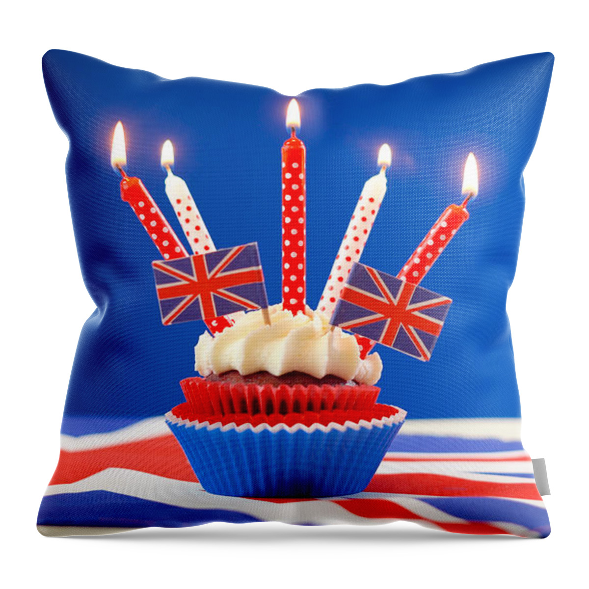 British Throw Pillow featuring the photograph Red white and blue theme cupcakes and cake stand with UK Union Jack flags #3 by Milleflore Images
