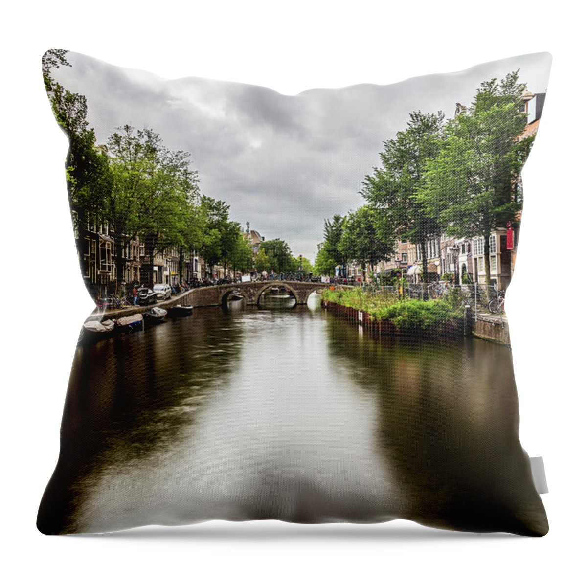 Canal Throw Pillow featuring the photograph Water canal in Amsterdam #3 by Fabiano Di Paolo
