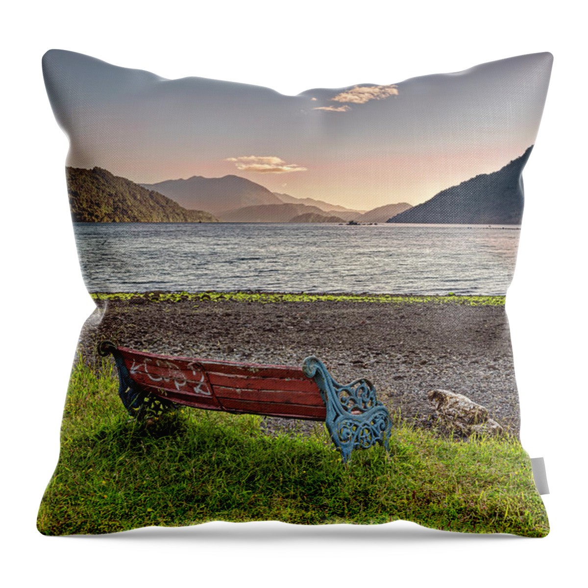 Chili Throw Pillow featuring the photograph Bench with a peacefull view on the Hornopiren fjord on sunset by Henri Leduc