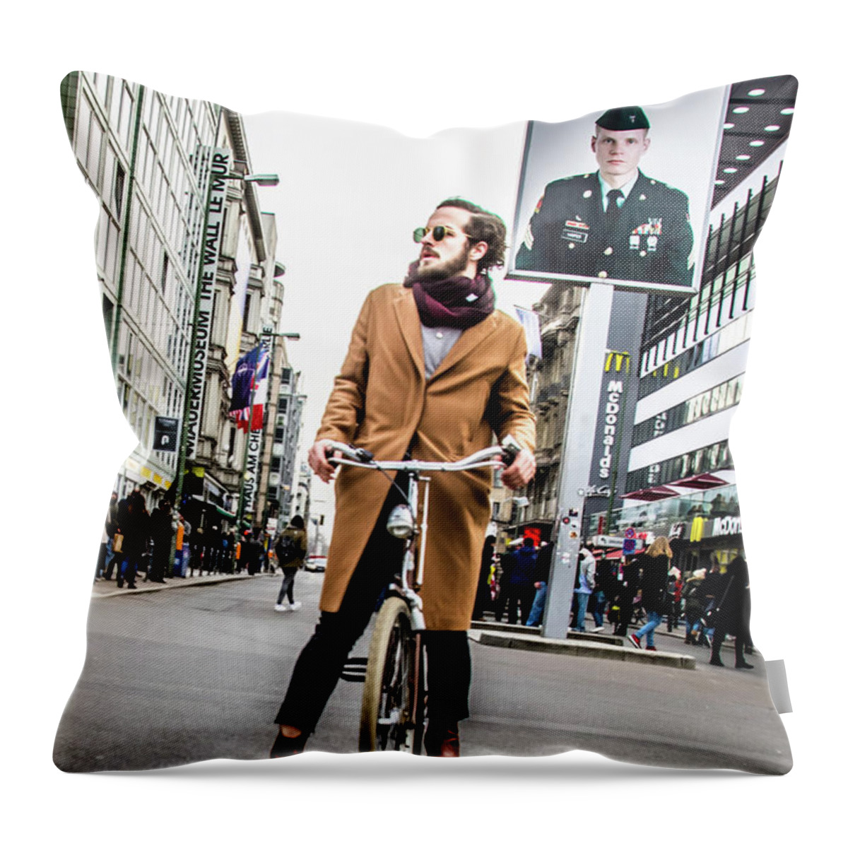 Berlin Throw Pillow featuring the photograph Berlin Hipster on BIcycle at Checkpoint Charlie by Tito Slack