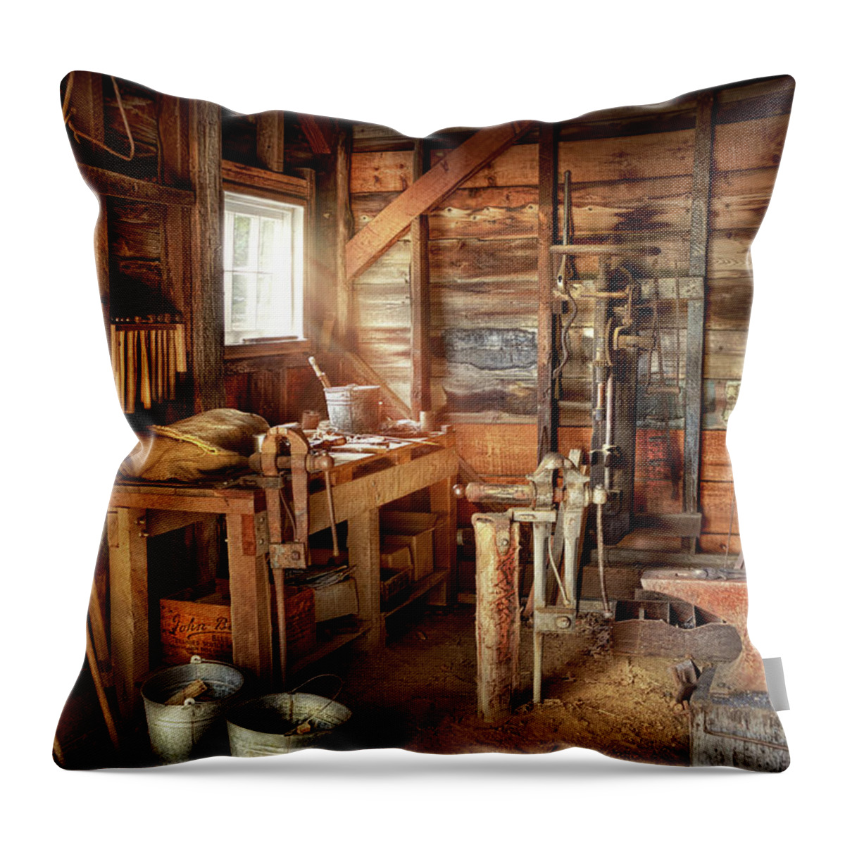 Blacksmith Throw Pillow featuring the photograph Blacksmith - Shapes iron with an anvil and hammer by Mike Savad