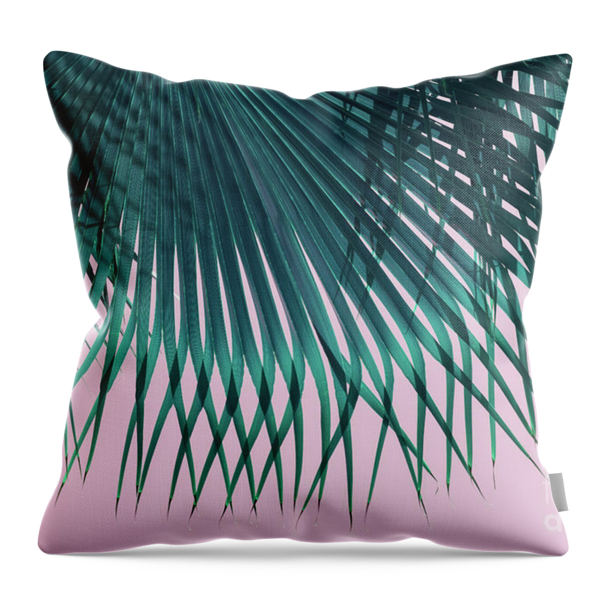 Palm Leaf Throw Pillow featuring the photograph Blue green palm leaf and pink sky on the beach by Adriana Mueller