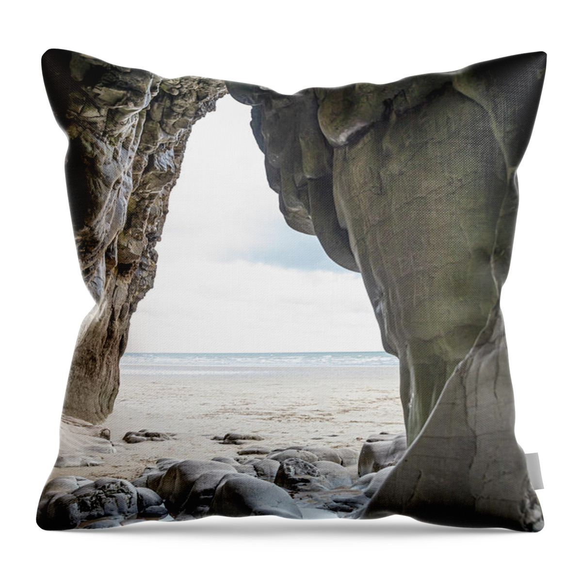 Cave Throw Pillow featuring the photograph Cave At Pendine Sands, Wales by Paul Thompson
