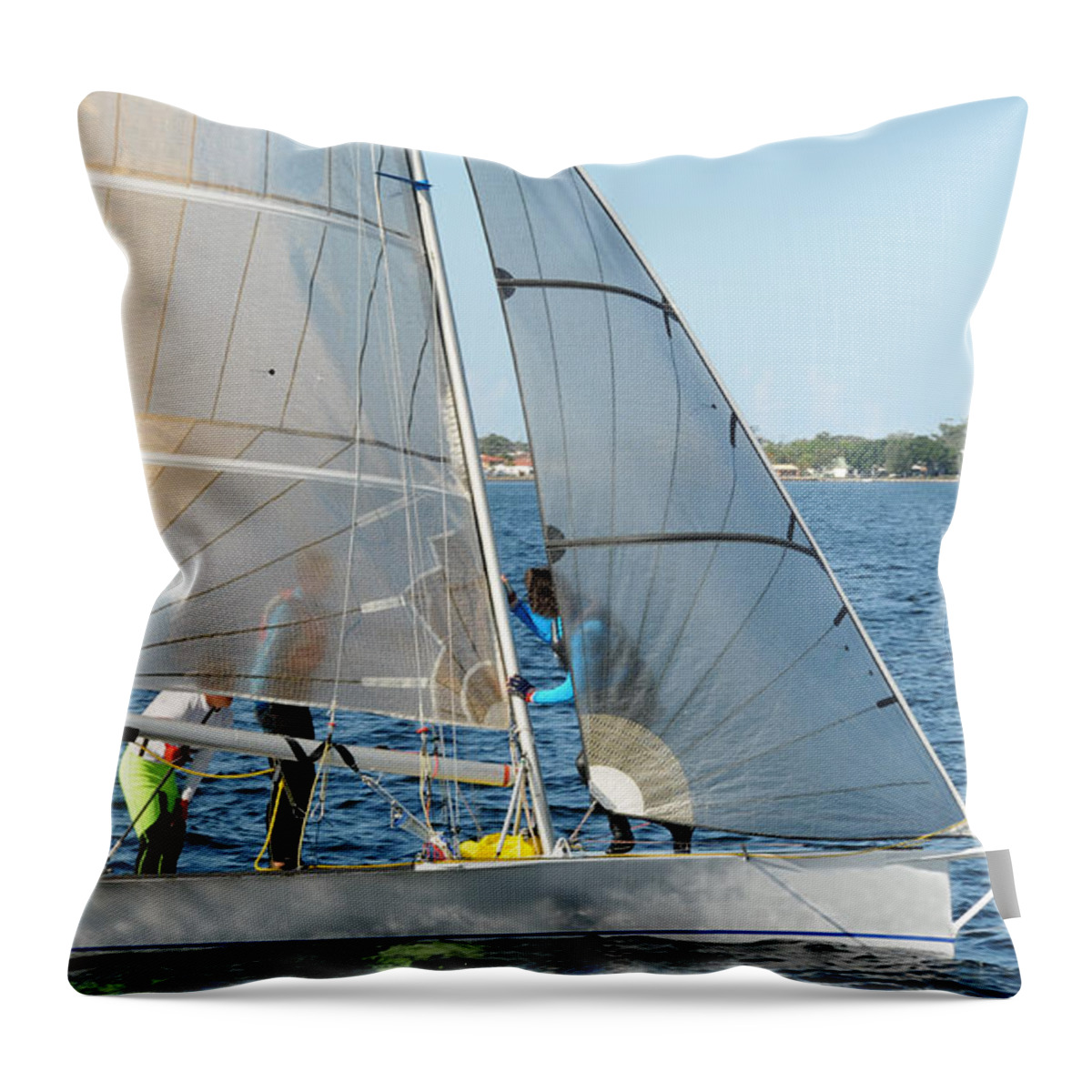 Sky Throw Pillow featuring the photograph Children Sailing small dinghy with white sails up-close on an in by Geoff Childs