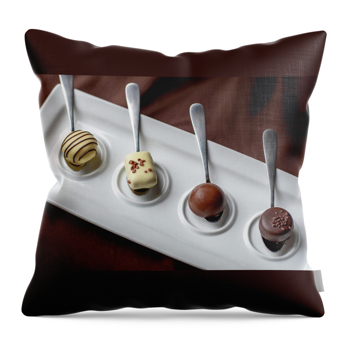 Food Throw Pillow featuring the photograph Chocolate on a silver spoon by Susan Sheldon