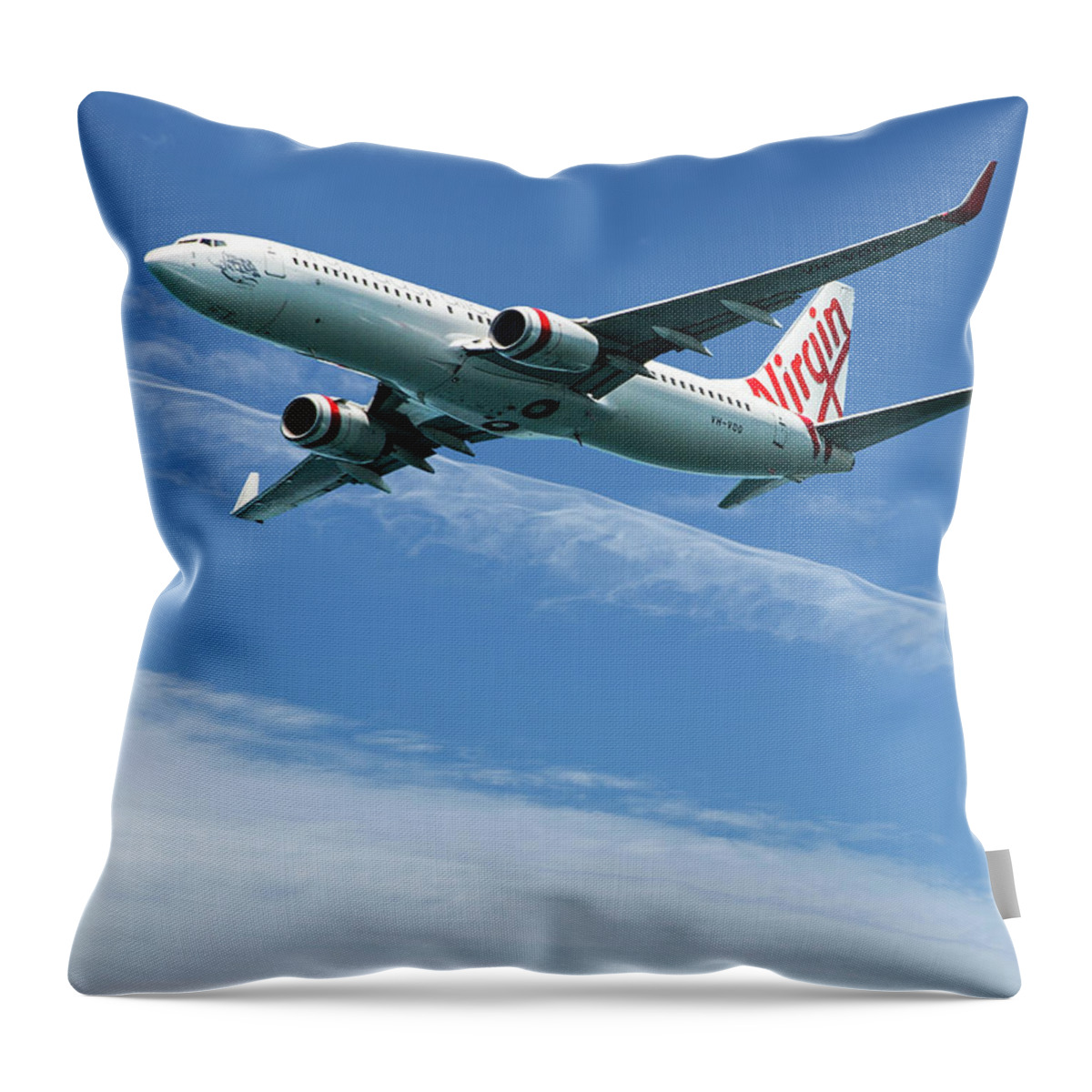 Wispy Throw Pillow featuring the photograph Commercial aircraft in flight with Cirrus cloud in blue sky. Aus by Geoff Childs