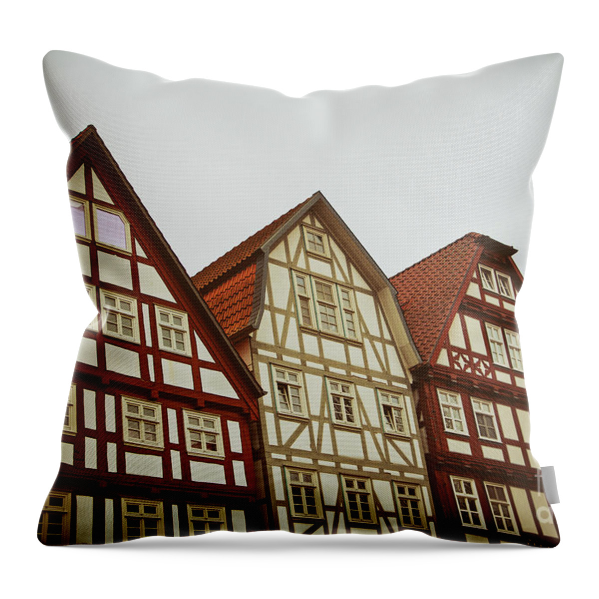 Architecture Throw Pillow featuring the photograph Cute historical half-timbered houses in Melsungen, Germany by Mendelex Photography