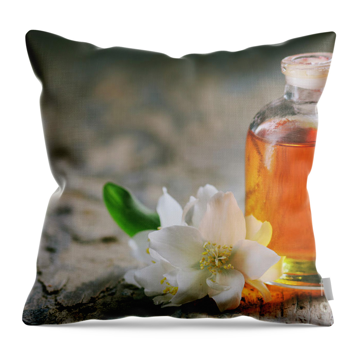 Essential Throw Pillow featuring the photograph Essential oil with jasmine flower by Jelena Jovanovic