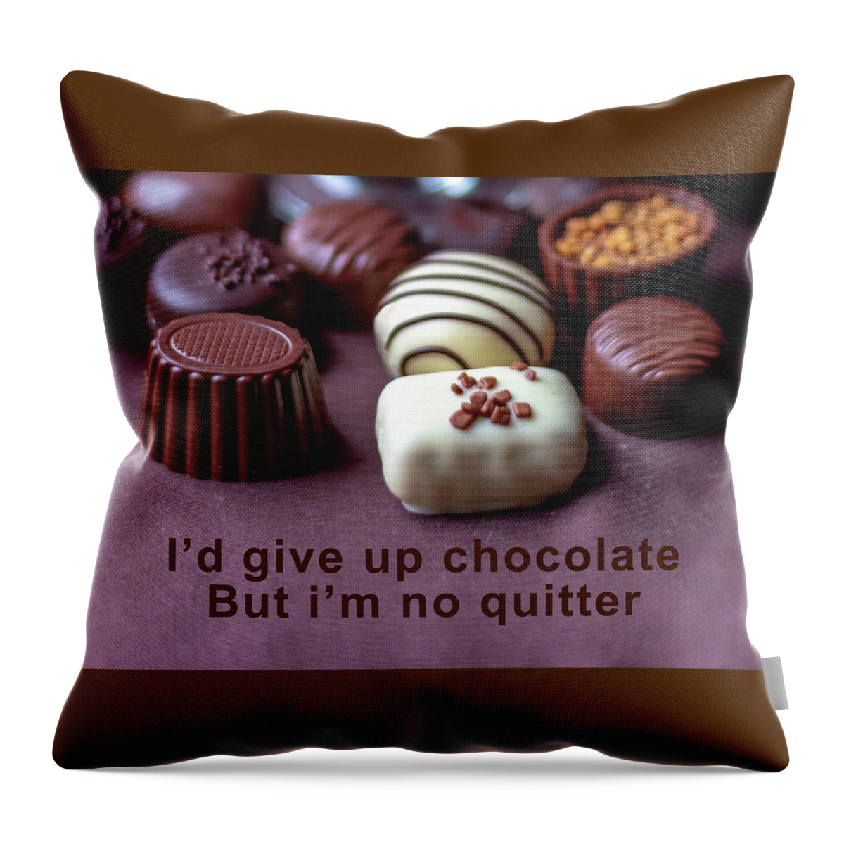 Food Throw Pillow featuring the photograph Fancy chocolates close up by Susan Sheldon