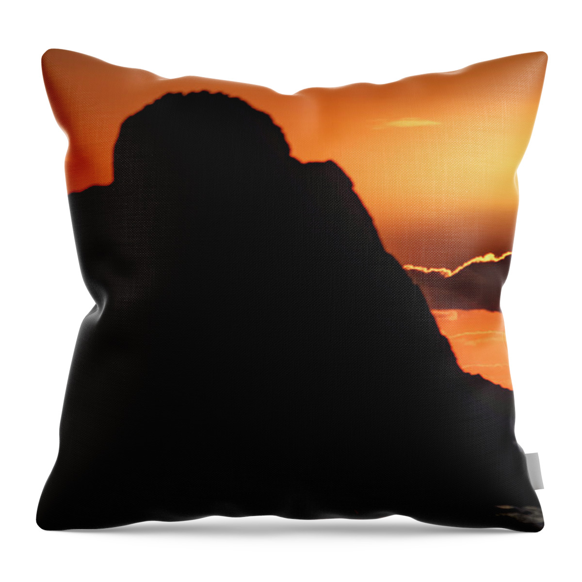 Oregon Coast Throw Pillow featuring the photograph Large rock with sunset behind a ckoud by Jeff Swan