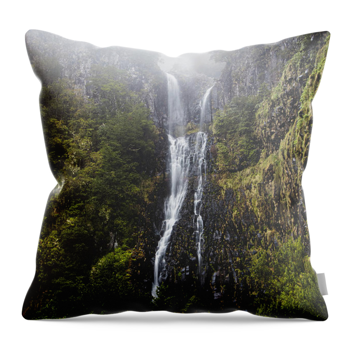 Risco Waterfall Throw Pillow featuring the photograph Majestic Risco waterfall immersed in mist and rain on the island of Madeira, Portugal. Discovering magical places in Europe by Vaclav Sonnek