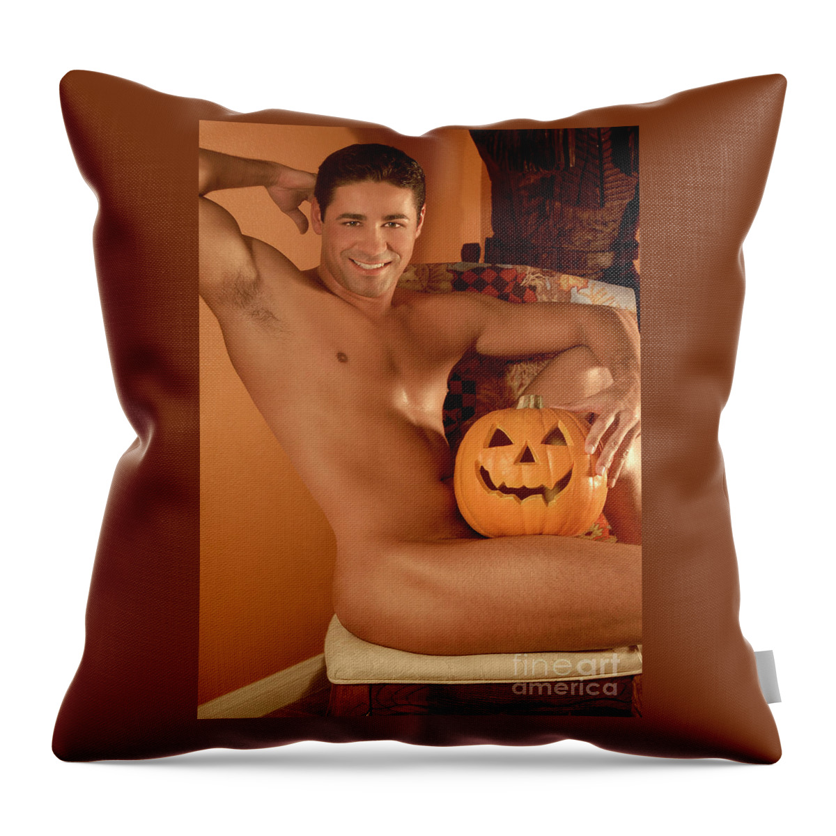 Young Throw Pillow featuring the photograph Male nude with Halloween Pumpkin by Gunther Allen
