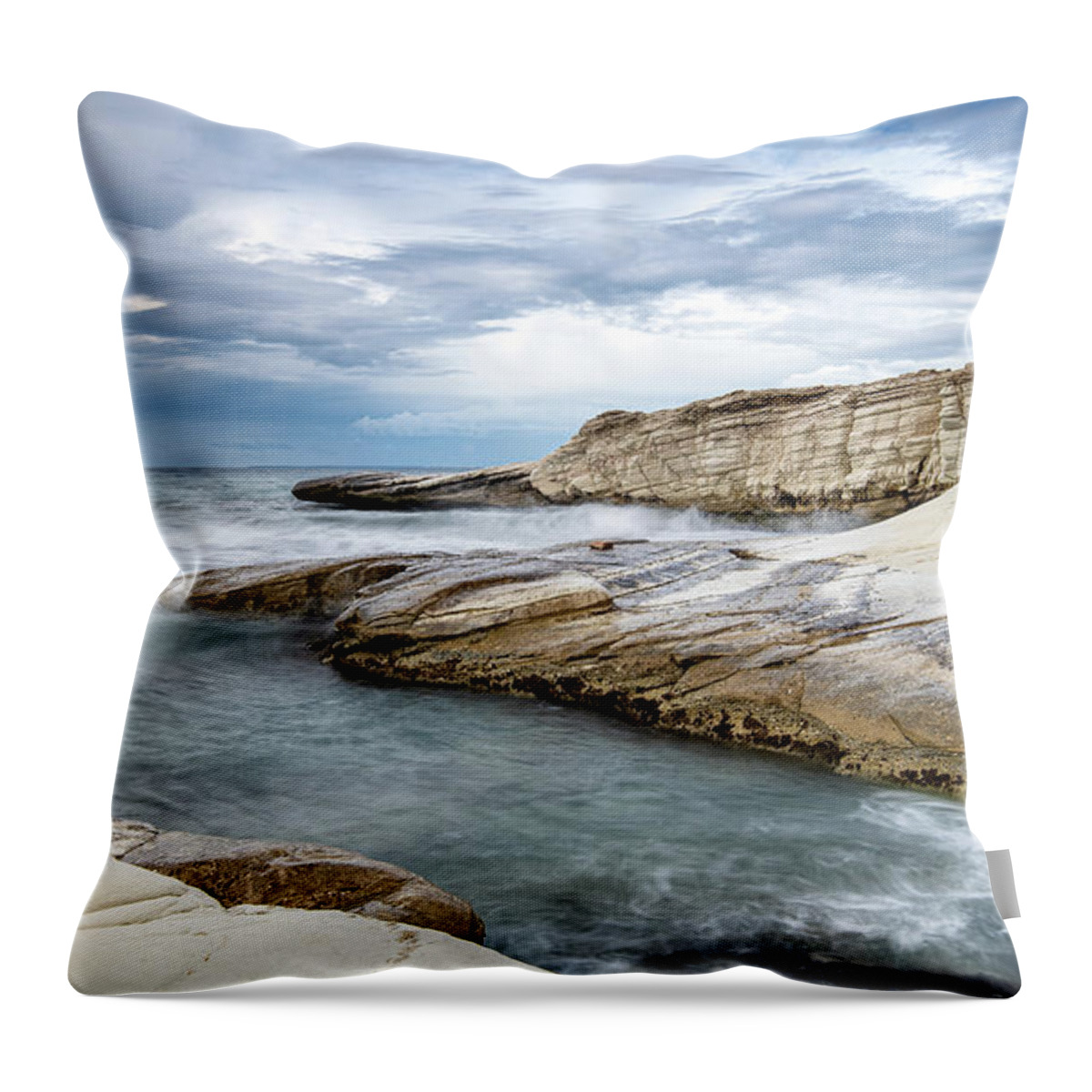 Seascape Throw Pillow featuring the photograph Rocky seacoast and waves splashing on with white rocks by Michalakis Ppalis
