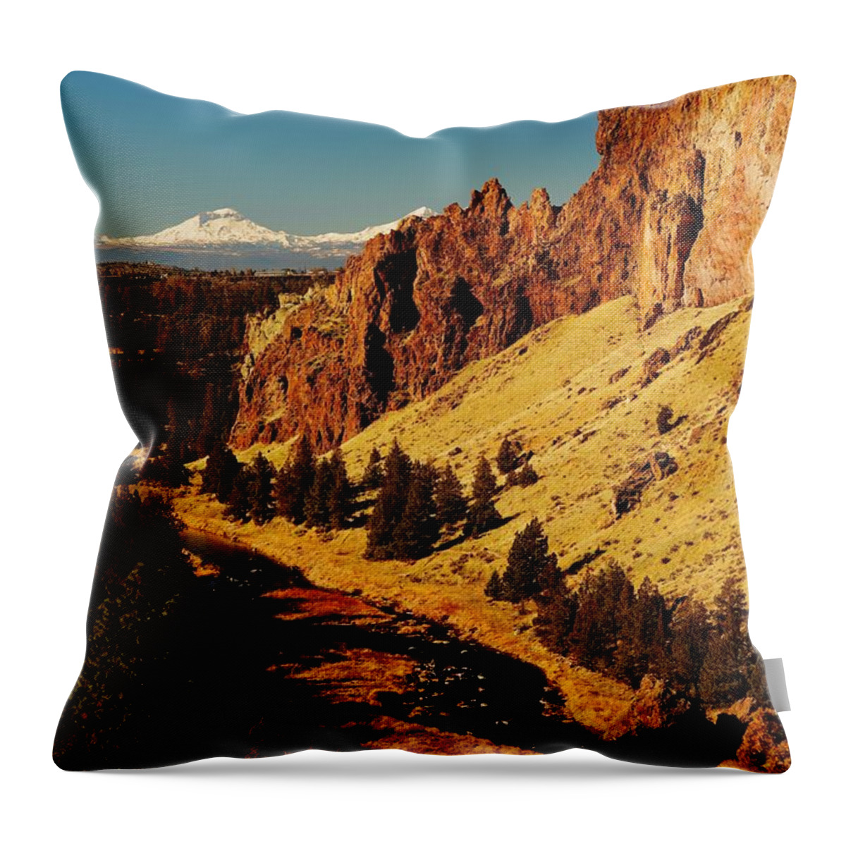 Snow Throw Pillow featuring the photograph Sunrise glow at Smith Rock with Snow covered Sisters Mountains by Brent Bunch