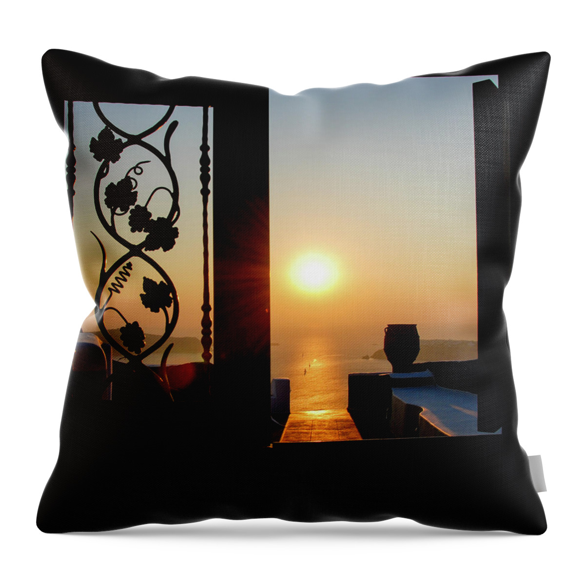 Nightfall Throw Pillow featuring the photograph Sunset in the aegean sea from a house. Santorini island Greece. by Michalakis Ppalis