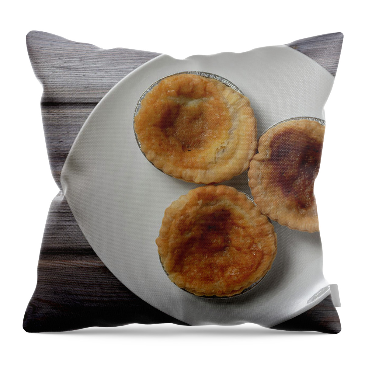 Afternoon Tea Throw Pillow featuring the photograph Three traditional bakewell puddings on a white plate top view by Scott Lyons