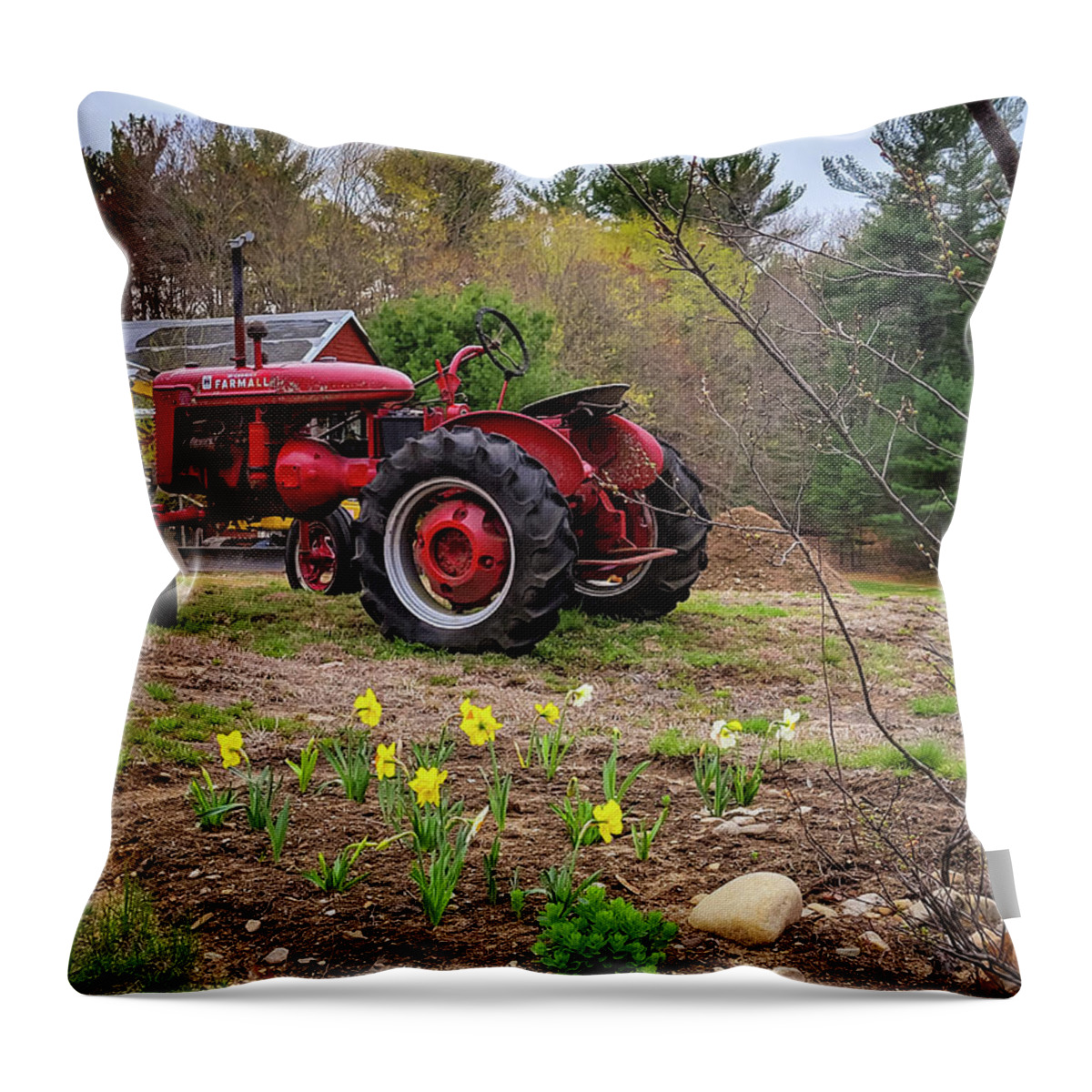 Mccormick Throw Pillow featuring the photograph Tractor and Daffodils by Mary Capriole