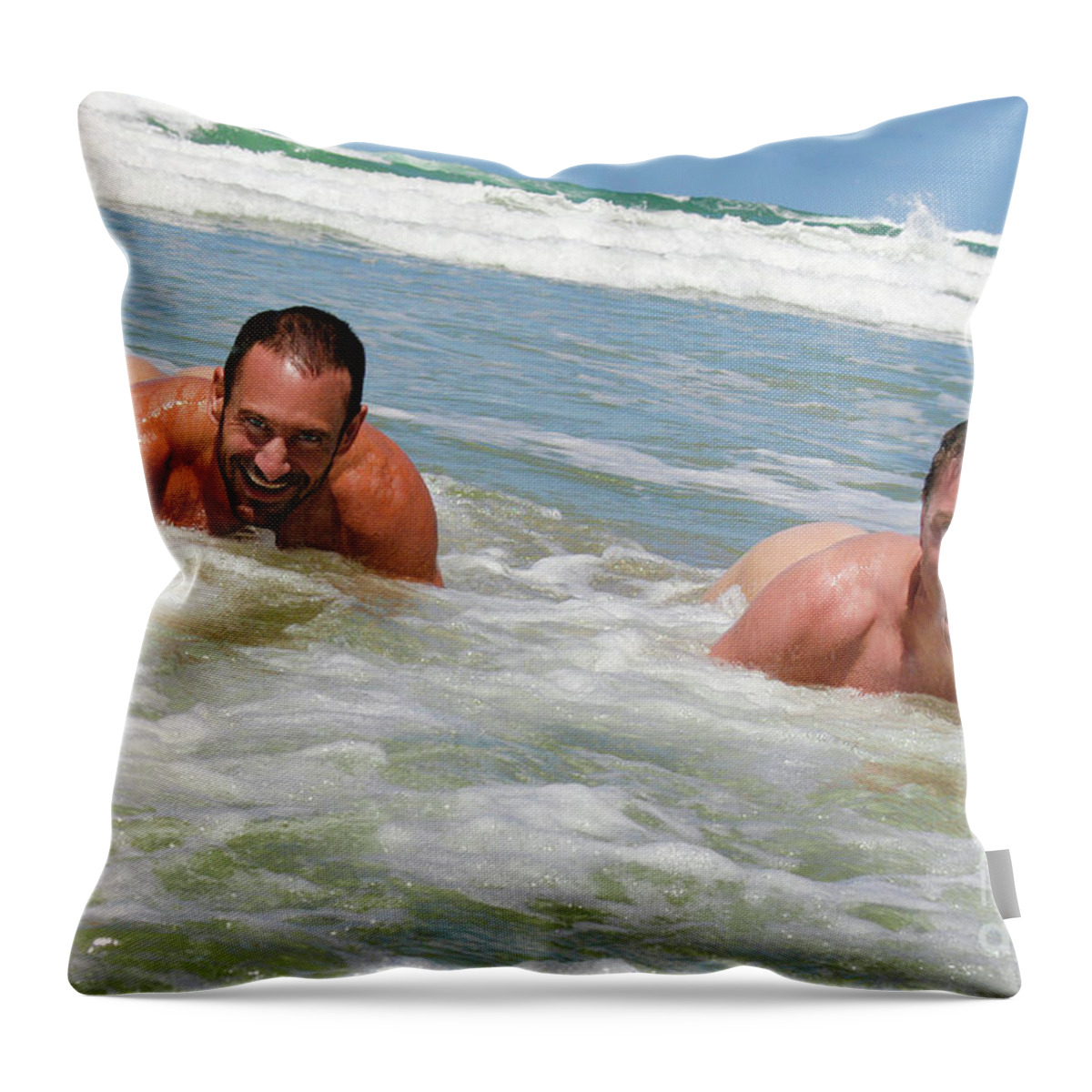 Gay Love Throw Pillow featuring the photograph Two hot naked men playing in the ocean. by Gunther Allen