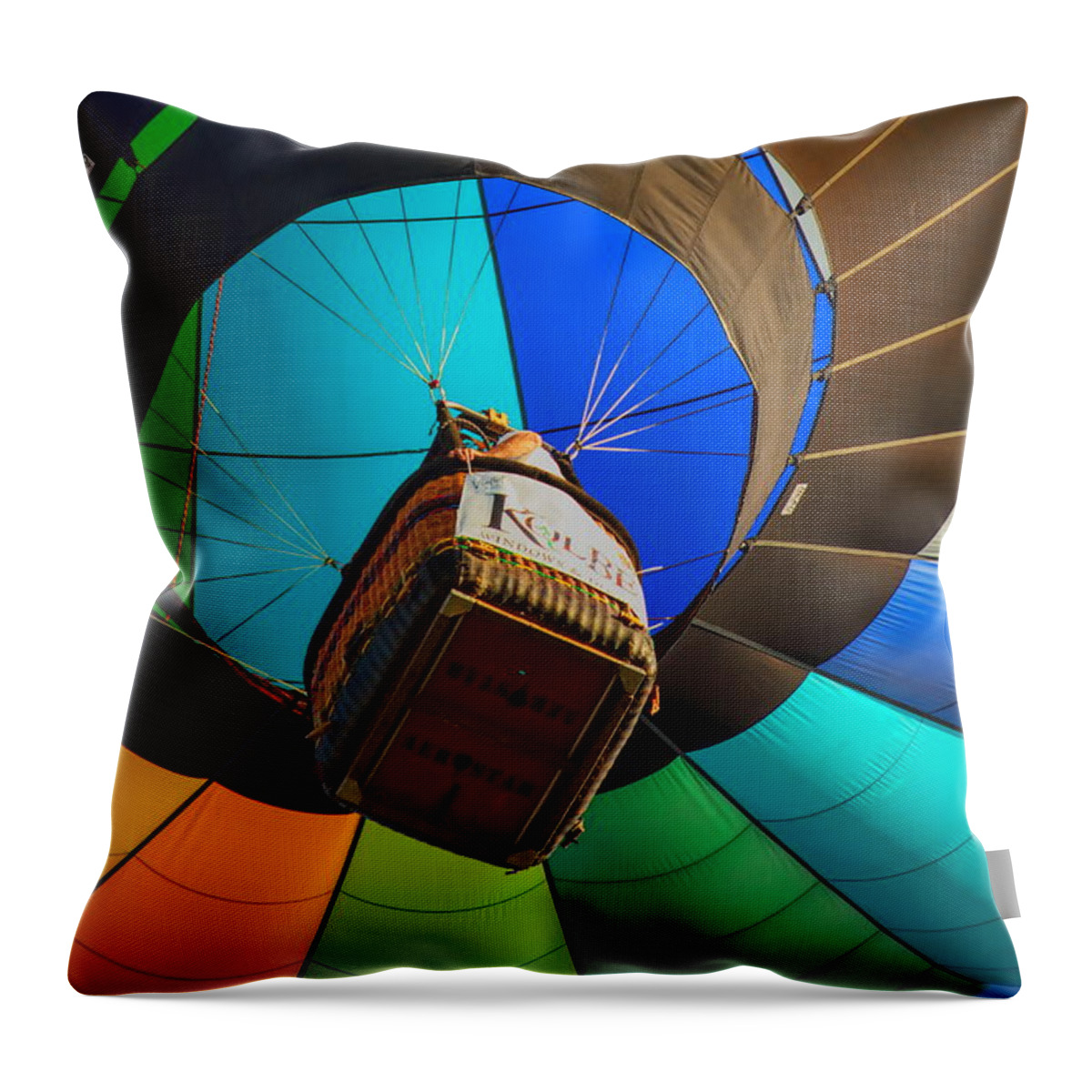 Wausau Throw Pillow featuring the photograph Underneath A Rainbow Colored Hot Air Balloon by Dale Kauzlaric
