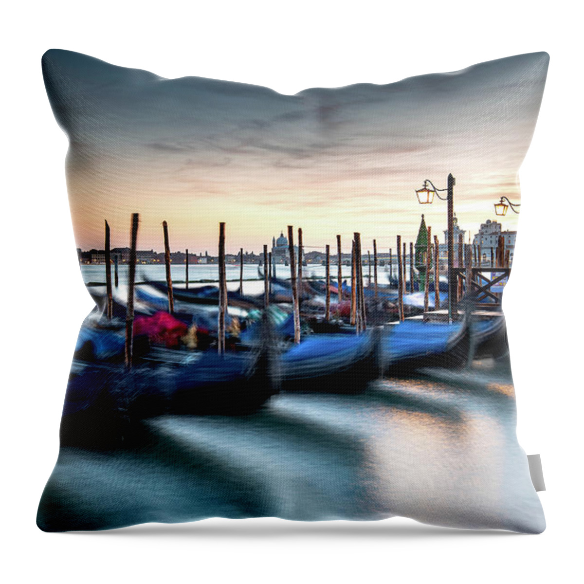 Gondola Throw Pillow featuring the photograph Venice Gondolas moored at the San Marco square. by Michalakis Ppalis