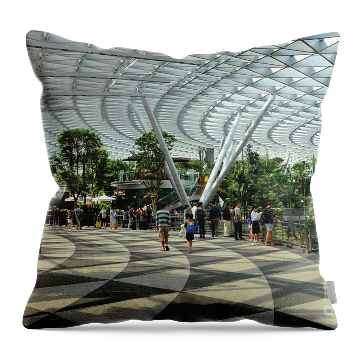 People Throw Pillow featuring the photograph Visitors walk near a cafe inside the Jewel attraction at Singapore's Changi Airport by Imran Ahmed
