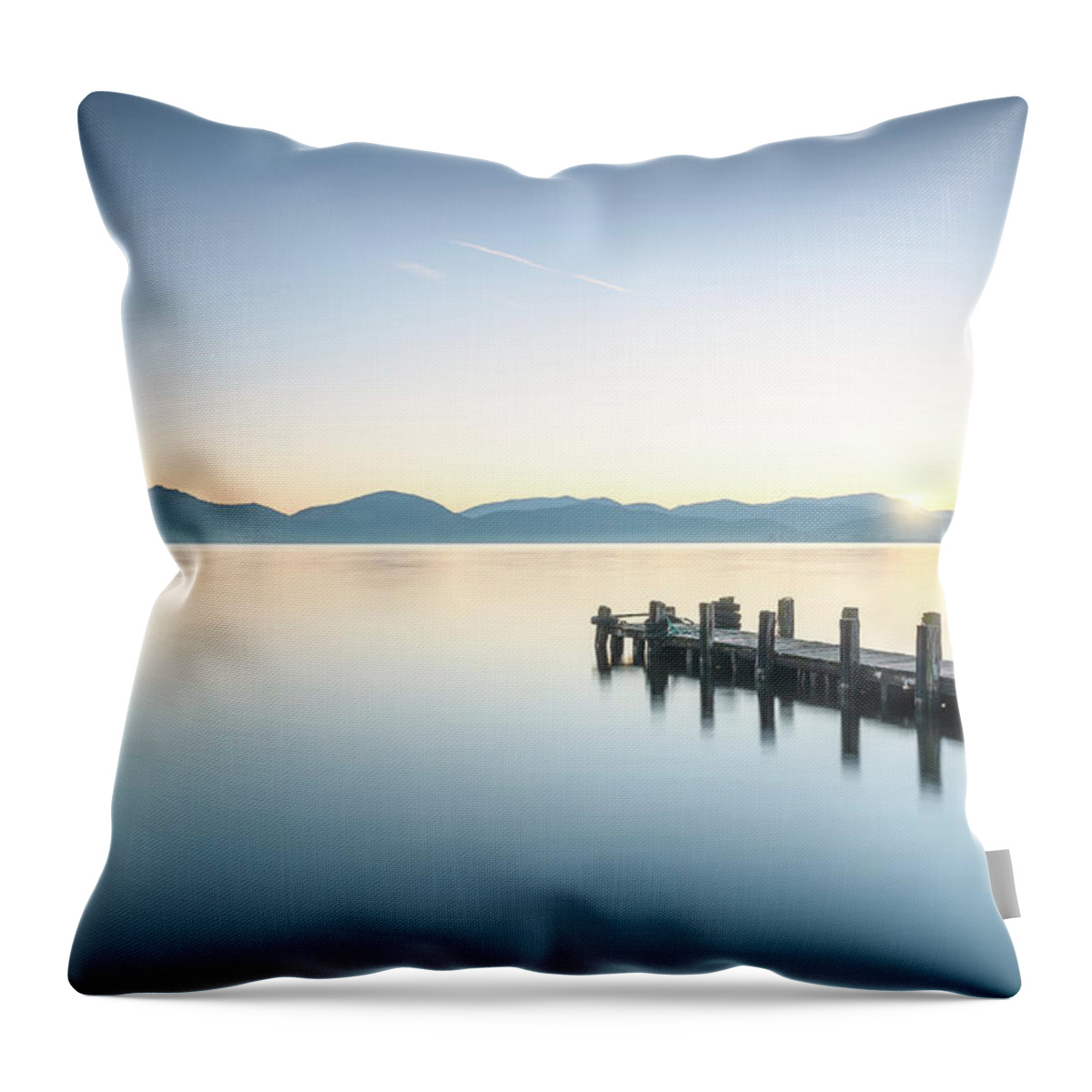 Lake Throw Pillow featuring the photograph Wooden pier at sunrise by Stefano Orazzini