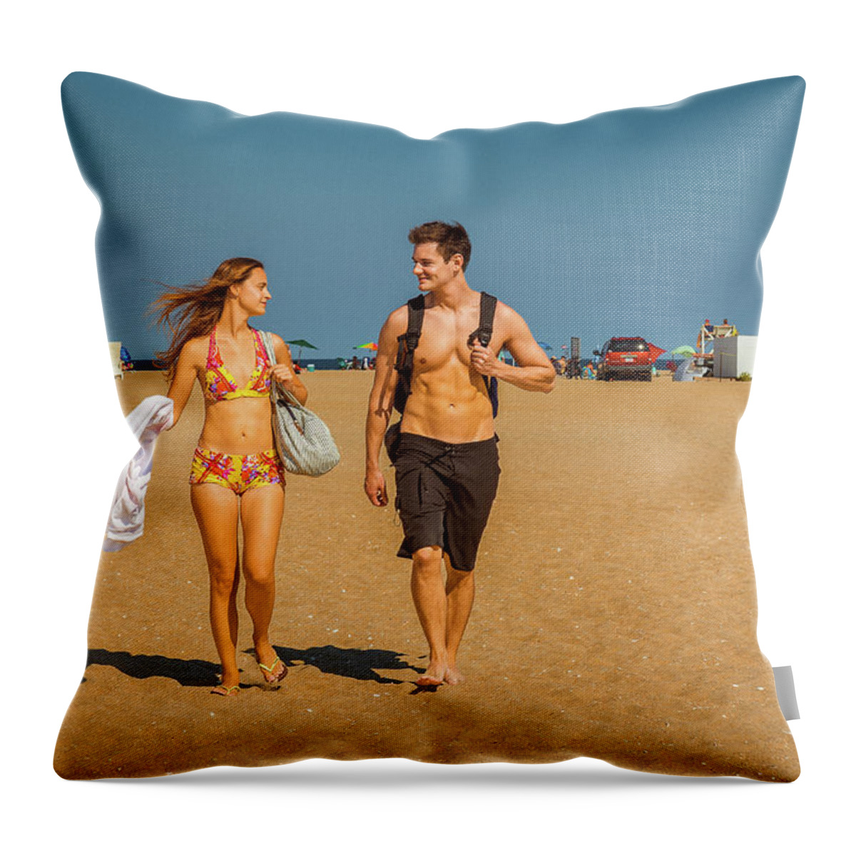 Young Throw Pillow featuring the photograph Young American Couple traveling, relaxing on the beach in New Je by Alexander Image